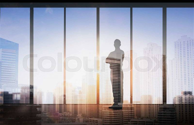 Business and people concept - silhouette of business man over double exposure office and city background, stock photo
