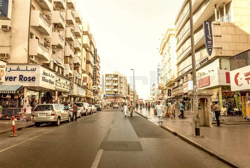 DUBAI - OCTOBER 21, 2015: Street of Deira area on a sunny day. Dubai attracts 15 million visitors annually, stock photo