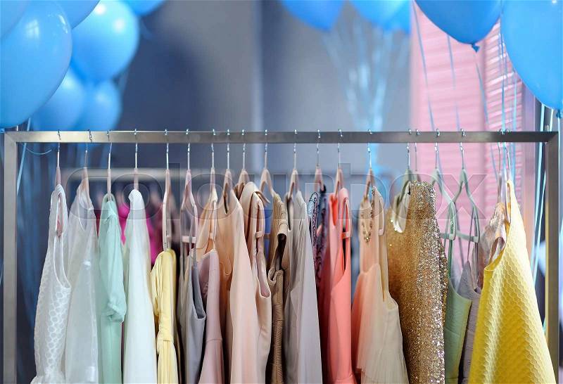 A few beautiful wedding or evening dresses on a hanger, stock photo