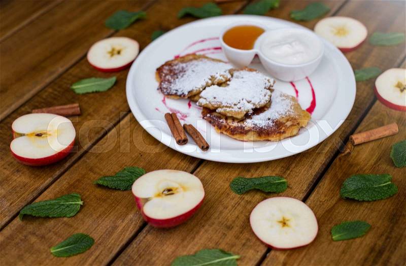 Pancake with apple cinnamon and mint, stock photo