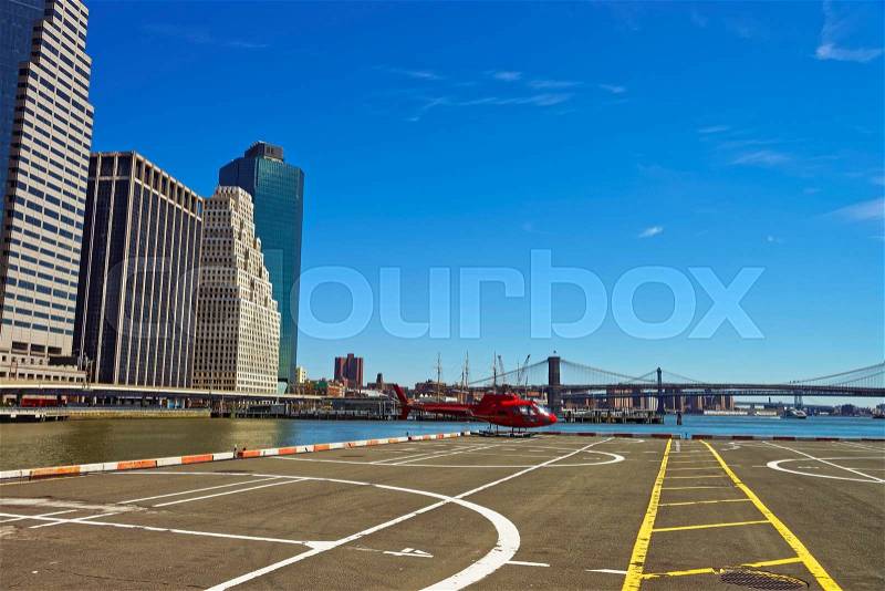 Helicopter and helicopter pad in Lower Manhattan in New York, USA, on East River. Pier 6, stock photo