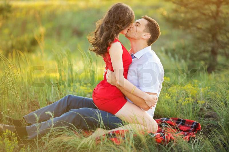 Beautiful Young Couple Have Romantic Dating in Park. Happy Man and Woman Kissing and Fall in Love Outdoor. Relationships, stock photo
