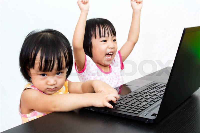 Asian Little Chinese Girls Playing Laptop Computer in Isolated White Background, stock photo