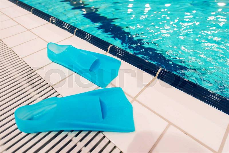 Swimming Pool Fun. Swimming Fins and the Pool. Recreation Concept Photo, stock photo