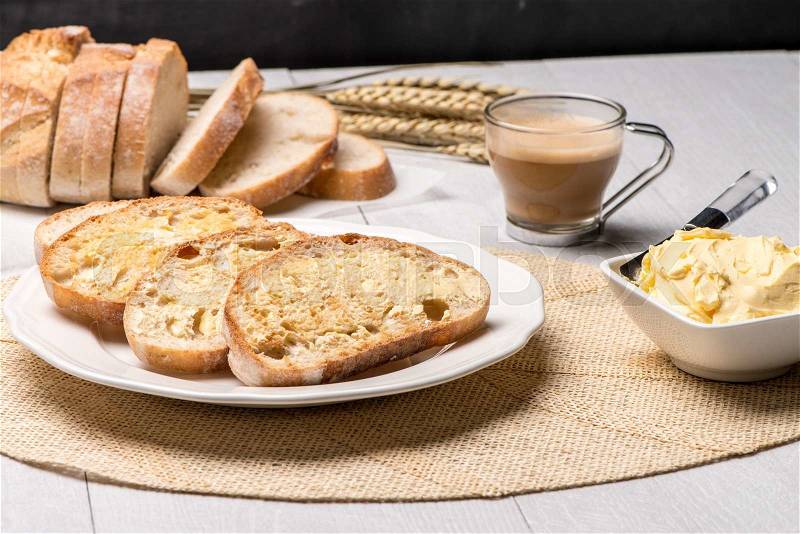 Breakfast table with bread toast with butter and milk with coffee, stock photo