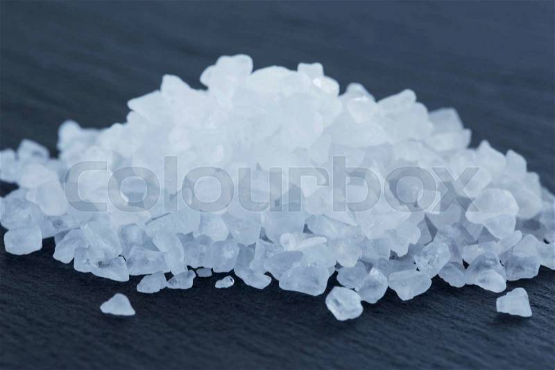 A handful of rock salt on the table, stock photo