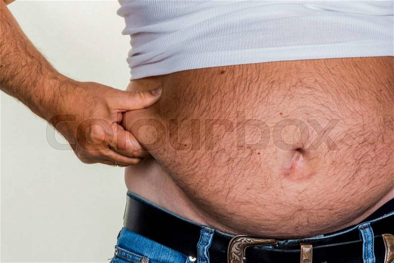 Man with overweight. symbol photo for beer belly, unsuccessful dieting and poor nutrition, stock photo