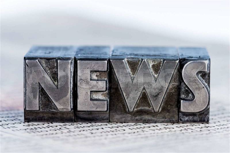 The word news written with lead letters. symbol photo for newsletters, newspapers and information, stock photo