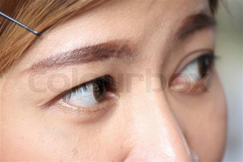 Close up image of human eye used fashion contact lens, stock photo