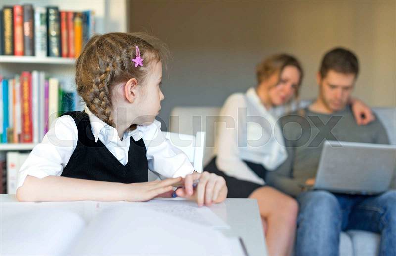 Little girl asking for help but parents ignoring her, stock photo