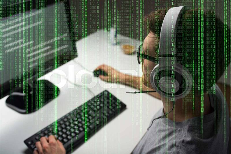 Technology, gaming, entertainment, let\'s play and people concept - close up of young man in headset and glasses with pc computer playing game at home and streaming playthrough or walkthrough video, stock photo