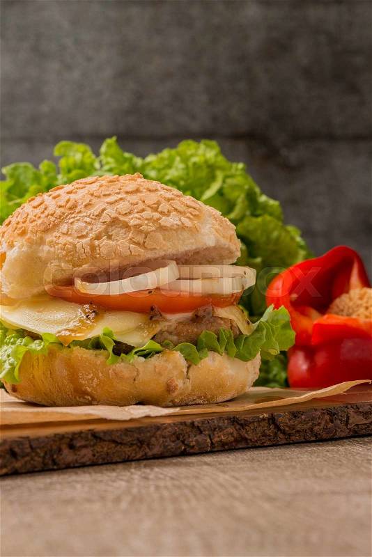 Homemade veggie burger served on wooden table, stock photo