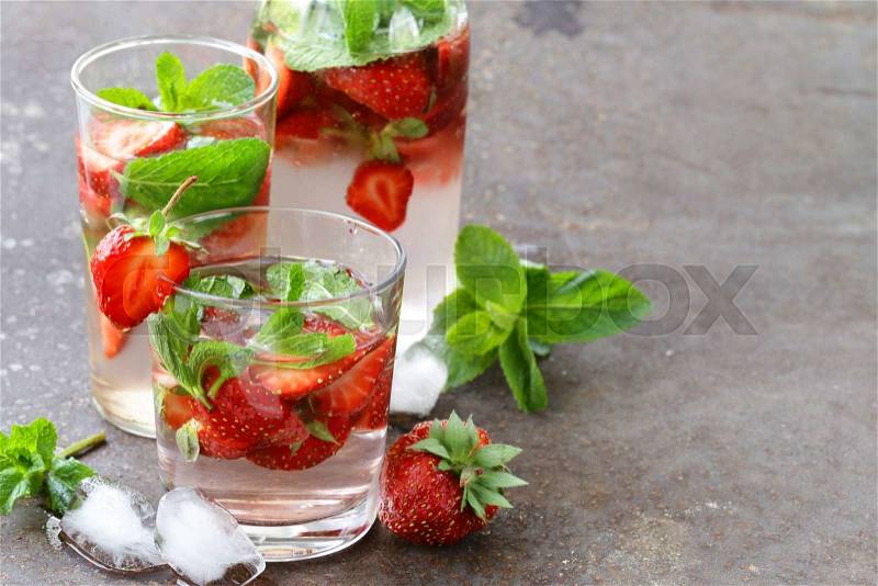 Summer strawberry lemonade with mint and ice, stock photo