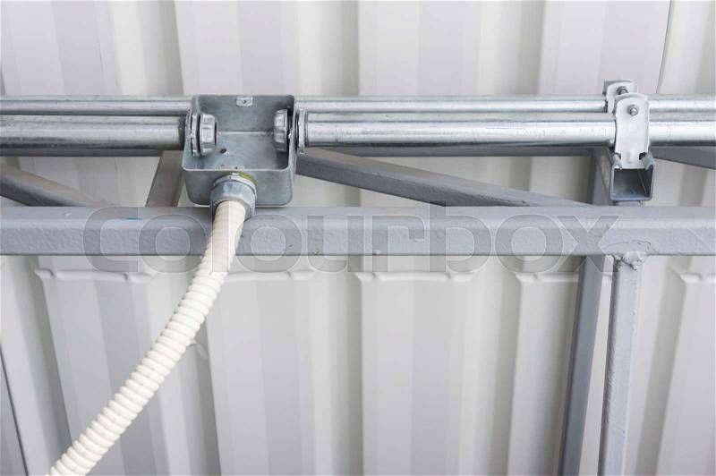 Electrical junction box with flexible conduit pipe connection, stock photo