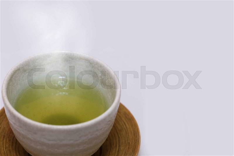 Hot cup of japanese matcha green tea with smoke, stock photo