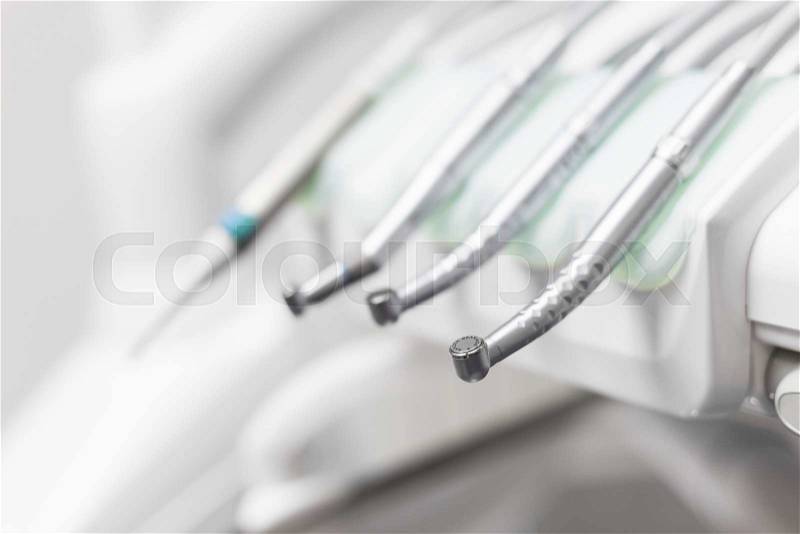 Closeup of a modern dentist tools, burnishers with blurred background, stock photo