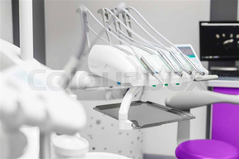 Modern dentist tools, burnishers view behind patient seat, stock photo