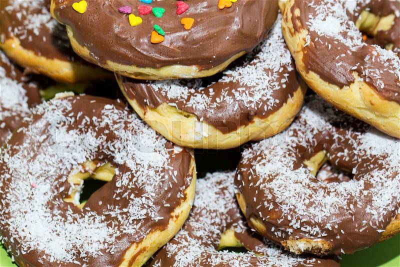 Dessert baking donuts with chocolate and coconut, stock photo