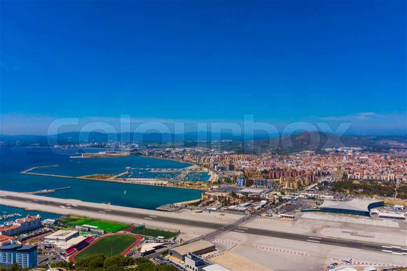 Gibraltar city and airport runway and La Linea de la Concepcion in Spain, stock photo