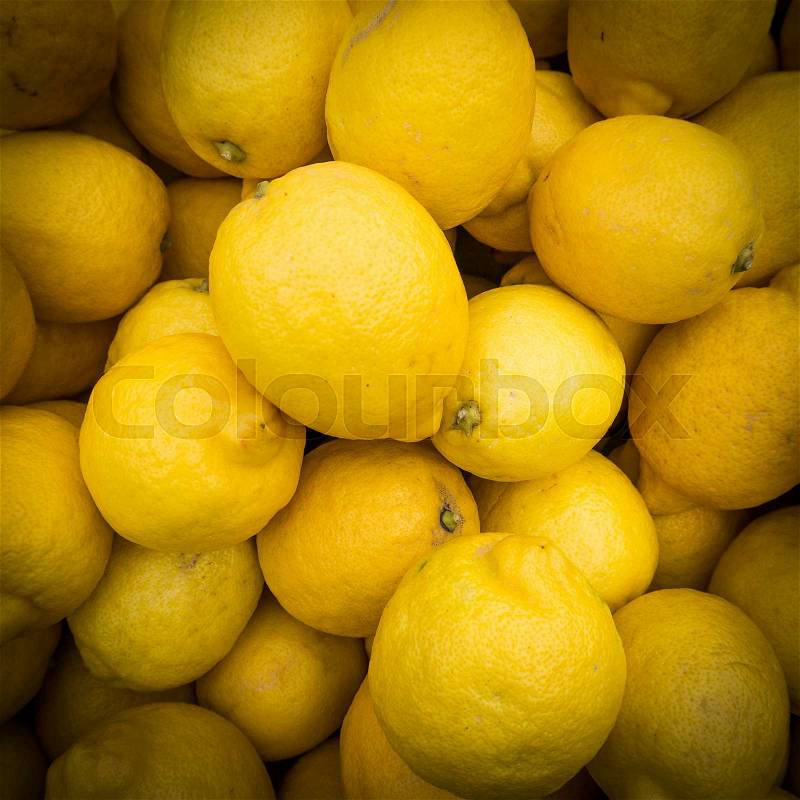Lemons background. Group of fresh lemons, stock photo