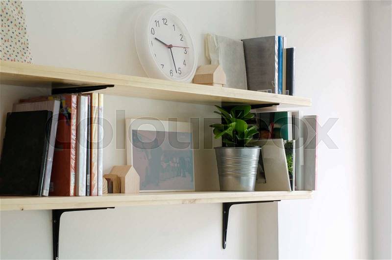 Books on a wooden shelf. Interior design, stock photo