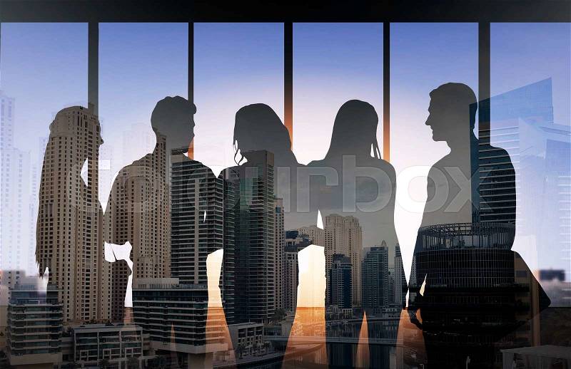 Business, education and people concept - people silhouettes over double exposure office and city background, stock photo