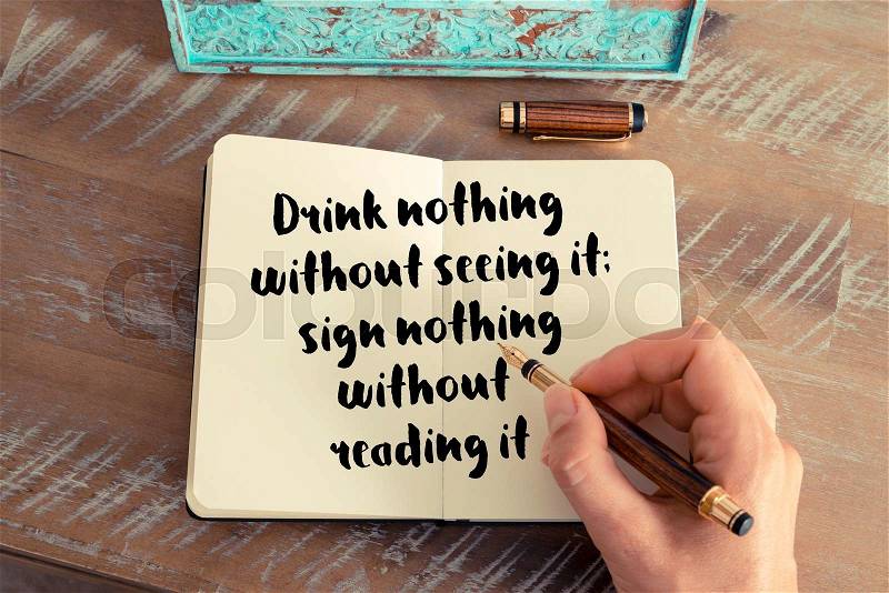 Handwritten quote Drink nothing with out seeing it; sign nothing without reading it as inspirational concept image, stock photo