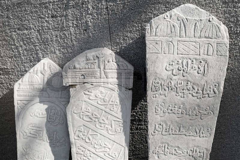Ancient white headstones with Arabic script carvings. Smyrna, Izmir, Turkey, stock photo