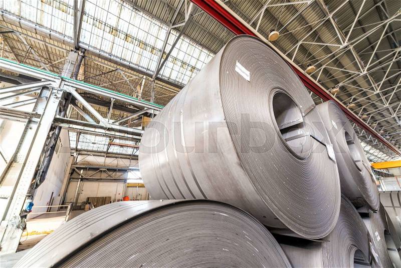Warehouse full of steel coils. Industrial concept, stock photo