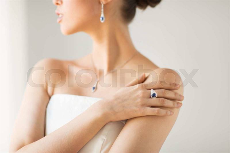 Glamour, beauty, jewelry and luxury concept - close up of beautiful woman with finger ring, stock photo