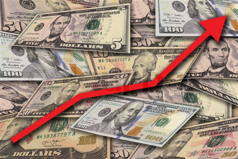 Concept image with pile of dollar banknotes in different currency 5, 10, 50, 100 dollar currency of the United States useful as a background with big red arrow graph pointing up, stock photo