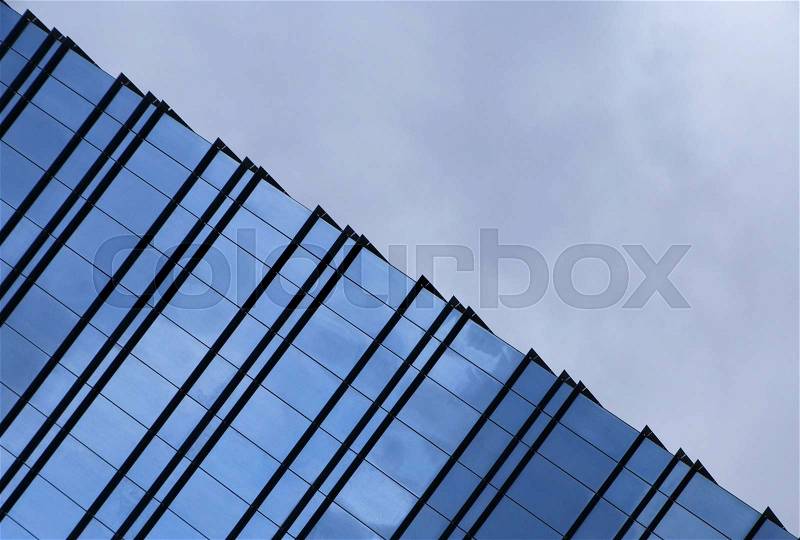 Clouds above pyramid of ofiice building, stock photo