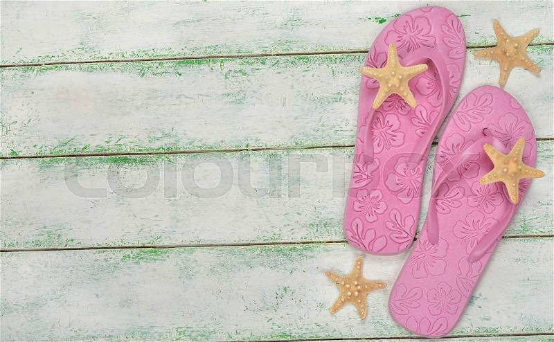 Pink beach sandals on a white background, stock photo