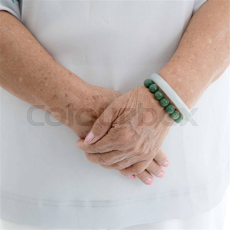 Aging process - old senior woman hands wrinkled skin, stock photo