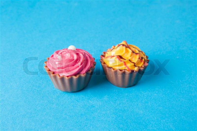 Birthday cupcakes on blue background. many sweet cupcakes, stock photo