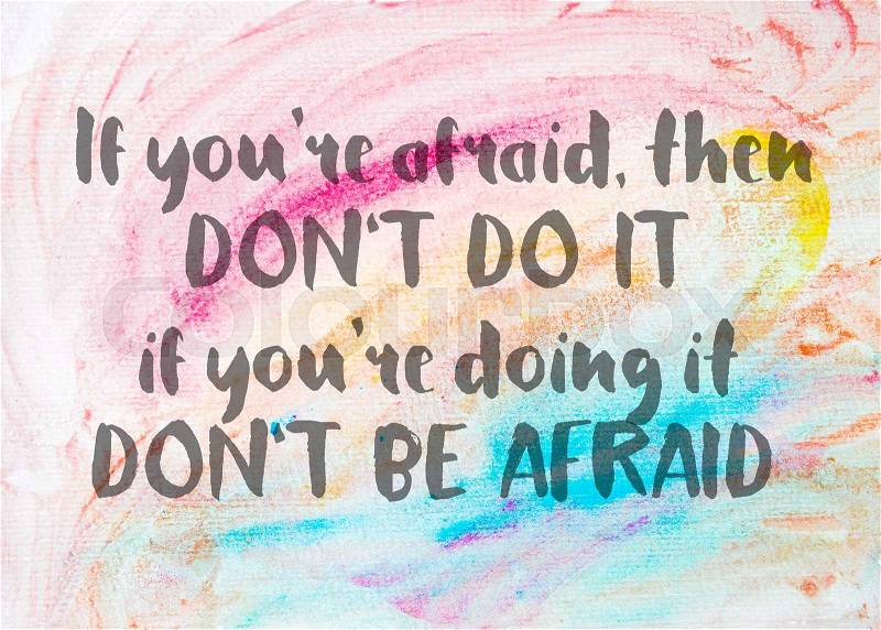 If you’re afraid don’t do it; if you’re doing it don’t be afraid. Inspirational quote over abstract water color textured background, stock photo