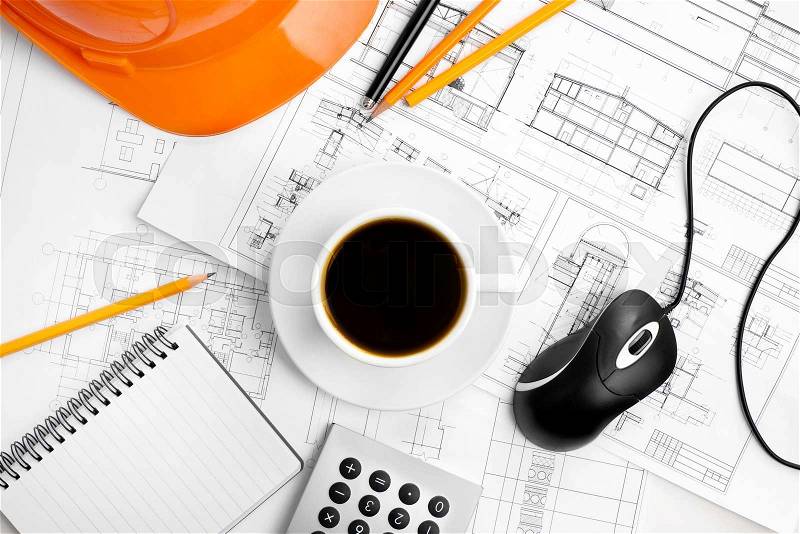 Construction plans and coffee, stock photo