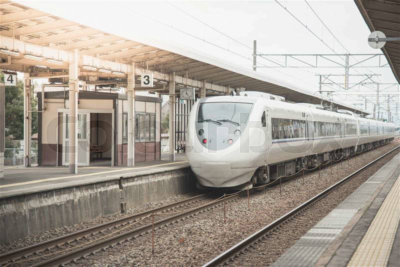 Modern high speed train at the railways station in Japan, stock photo