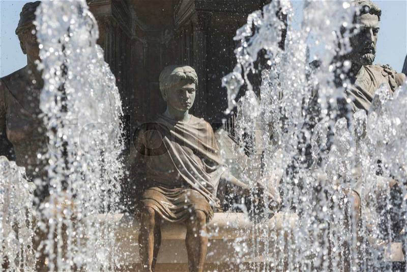 Large water fountain and bronze sculptures of adults and children in Skopje, Macedonia, Europe. , stock photo