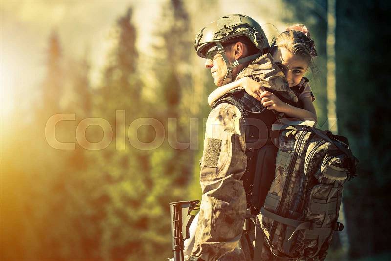 Soldier Returning Home After Years of War. Happy Daughter Welcoming Her Dad at Home. Troop Returning Concept, stock photo