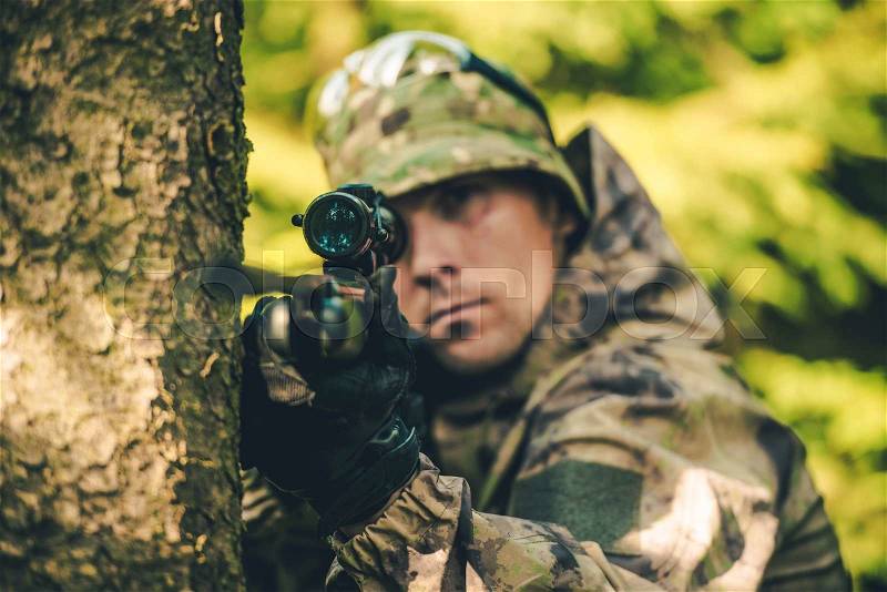 Wildlife Hunter with Rifle Spotting Deer. Hunter Poacher Concept Photo, stock photo