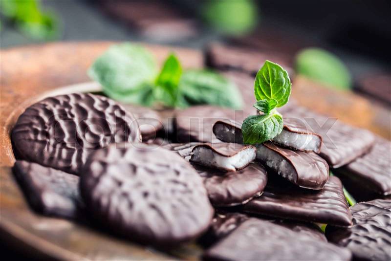 Chocolate peppermint cookies.Mint. Peppermint. Menthol. Black chocolate with peppermint cream. Black chocolate with mint stuffing. Menthol chocolate with mint leaves. Toned images, stock photo