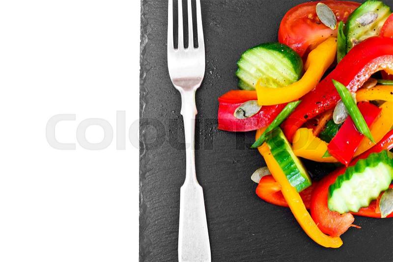 Healthy and diet food: Lettuce, tomato, pepper, seeds, oil, salt. Studio Photo, stock photo