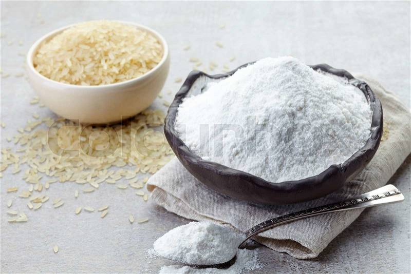 Bowl of rice flour and bowl of rice, stock photo