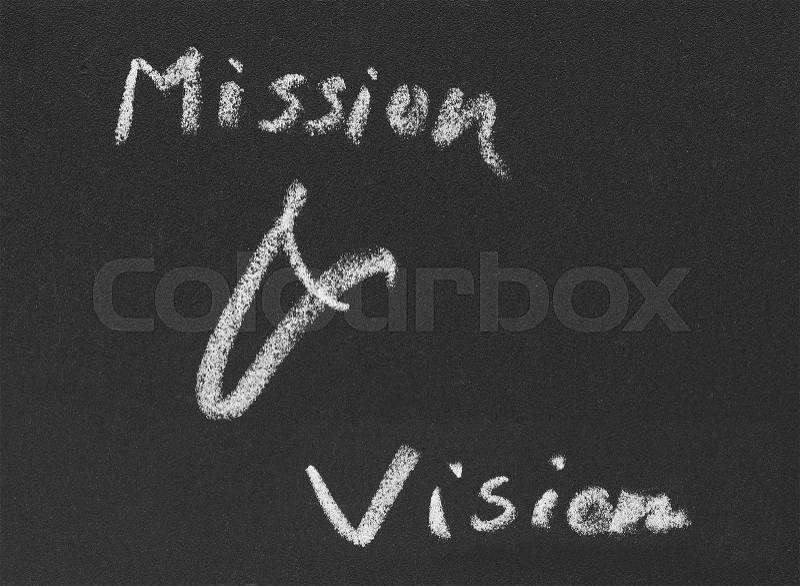 Mission & vision written in blackboard by white chalk, stock photo