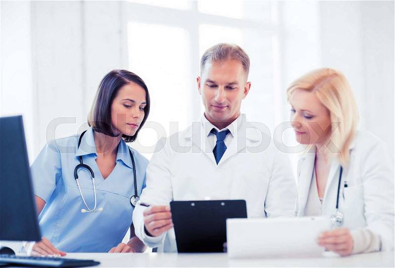 Healthcare and medical concept - team or group of doctors on meeting, stock photo
