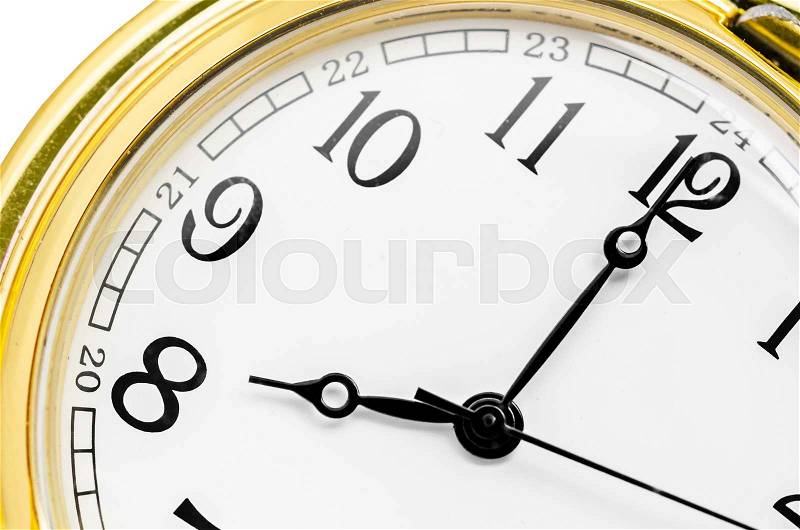Close up gold clock face on white background, stock photo