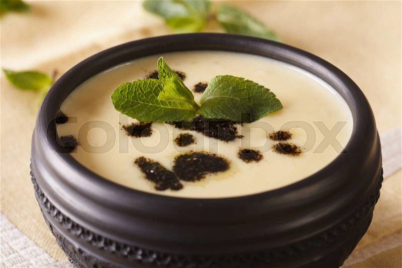 Turkish Yayla soup with rice, mint and yoghurt in a bowl close-up on the table. horizontal , stock photo