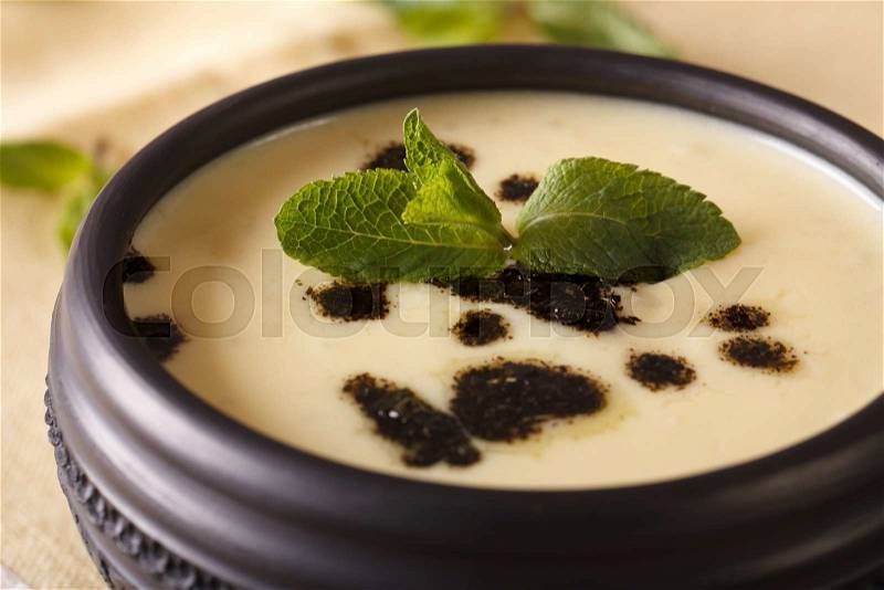Turkish Yayla soup with mint and yogurt in a bowl macro on the table. horizontal , stock photo