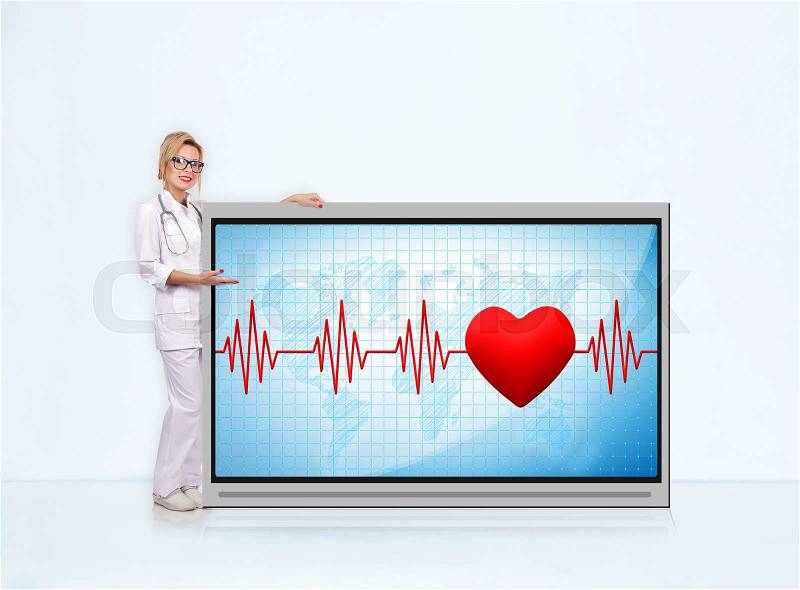 Woman doctor with stethoscope showing pulse rate on tv screen, stock photo